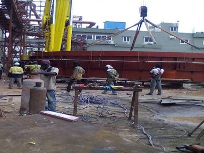 Welders working on structural steel